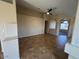 Open concept living room with tile floors, open doorways and neutral colored walls at 8179 W Clara Ln, Peoria, AZ 85382