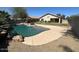 Backyard pool and patio area with desert landscaping at 8179 W Clara Ln, Peoria, AZ 85382