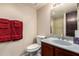 Cozy bathroom featuring a toilet, a vanity, and a shower with modern fixtures at 8201 N 21St Dr # C204, Phoenix, AZ 85021