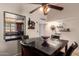 Dining Area featuring ceiling fan and views to the kitchen and main living area at 8201 N 21St Dr # C204, Phoenix, AZ 85021