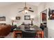 Open dining area with chandelier, ceiling fan and views to living room and kitchen at 8201 N 21St Dr # C204, Phoenix, AZ 85021