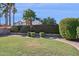 Spacious backyard featuring a meticulously manicured lawn and vibrant landscaping at 9264 E Hillery Way, Scottsdale, AZ 85260