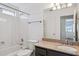 Bathroom featuring shower-tub combo, granite counters and vanity at 9264 E Hillery Way, Scottsdale, AZ 85260