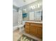 Functional bathroom with a shower-tub combination, a vanity, and a neutral-colored tile floor at 9264 E Hillery Way, Scottsdale, AZ 85260