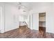 Spacious bedroom with wood floors, a ceiling fan, and sliding closet doors to maximize space at 9264 E Hillery Way, Scottsdale, AZ 85260