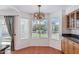 Breakfast nook features bright windows and a modern light fixture adjacent to the kitchen at 9264 E Hillery Way, Scottsdale, AZ 85260