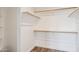 Walk-in closet with custom wood shelving at 9264 E Hillery Way, Scottsdale, AZ 85260