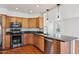 Well-equipped kitchen with stainless steel appliances and granite countertops at 9264 E Hillery Way, Scottsdale, AZ 85260