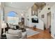Bright living room with high ceilings, large windows, hardwood floors, and a modern staircase at 9264 E Hillery Way, Scottsdale, AZ 85260