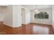 Spacious room featuring hardwood floors, stylish lighting, and large windows with outdoor views at 9264 E Hillery Way, Scottsdale, AZ 85260