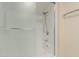 Bright and clean bathroom featuring a glass door shower and grab bar for convenience at 9730 W Gulf Hills Dr, Sun City, AZ 85351