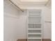 Walk-in closet with built-in shelving unit, providing ample storage and organization options at 9730 W Gulf Hills Dr, Sun City, AZ 85351