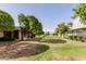 Charming community featuring green lawns, mature trees and inviting residential buildings at 9730 W Gulf Hills Dr, Sun City, AZ 85351