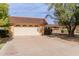 Charming home featuring a well-maintained front yard and a two-car garage at 9730 W Gulf Hills Dr, Sun City, AZ 85351