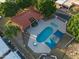 Aerial shot of community pool with ample lounging space under shade sails, next to a clubhouse at 1005 W Berridge Ln, Phoenix, AZ 85013