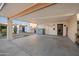 Expansive covered carport featuring a convenient storage shed and easy access to the home's entry and courtyard at 1005 W Berridge Ln, Phoenix, AZ 85013