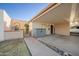 Spacious covered carport provides ample parking and leads to a charming courtyard and the home's entrance at 1005 W Berridge Ln, Phoenix, AZ 85013