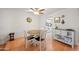 Eat-in kitchen featuring hardwood floors, a wood table, and seating for four people at 1005 W Berridge Ln, Phoenix, AZ 85013