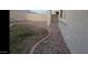 A backyard featuring grass, rocks, and a concrete border at 10382 W Cashman Dr, Peoria, AZ 85383