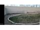 Backyard featuring lawn and concrete retaining wall at 10382 W Cashman Dr, Peoria, AZ 85383