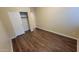 Simple bedroom with light-colored walls and hardwood flooring at 10382 W Cashman Dr, Peoria, AZ 85383