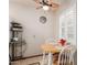 Cozy breakfast nook with a round table, white chairs, and bright natural light from the shuttered windows at 10510 W Palmeras Dr, Sun City, AZ 85373