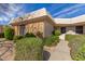 Inviting single-story home featuring lush green landscaping and a tile roof at 10510 W Palmeras Dr, Sun City, AZ 85373