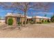 Charming single-story home featuring a well-maintained gravel yard and mature landscaping at 10510 W Palmeras Dr, Sun City, AZ 85373