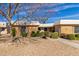 Inviting single-story home featuring a well-kept gravel yard and mature landscaping at 10510 W Palmeras Dr, Sun City, AZ 85373