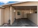 A covered carport featuring direct access to the front door and an exterior window at 10924 W Santa Fe Dr, Sun City, AZ 85351