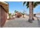 This desert landscaped yard features a brick patio and a screened in outdoor living space at 11067 W White Mountain Rd, Sun City, AZ 85351