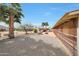 A spacious backyard features desert landscaping and a covered patio at 11067 W White Mountain Rd, Sun City, AZ 85351