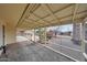 A covered patio overlooks the backyard with desert landscaping at 11067 W White Mountain Rd, Sun City, AZ 85351