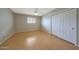 Bedroom with laminate floors, ceiling fan, and a closet at 11067 W White Mountain Rd, Sun City, AZ 85351