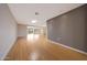 Expansive living room with lots of natural light and attractive wood flooring throughout at 11067 W White Mountain Rd, Sun City, AZ 85351