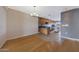 Open-concept kitchen and living area featuring a hardwood floors and natural light at 11067 W White Mountain Rd, Sun City, AZ 85351