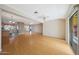 Bright living area featuring wood floors and seamless flow to outdoor patio at 11067 W White Mountain Rd, Sun City, AZ 85351