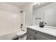 Bathroom with modern vanity, neutral colors, and a shower-tub combo at 11229 E Emelita Ave, Mesa, AZ 85208