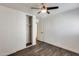 Bedroom with a closet, ceiling fan, neutral paint colors and modern flooring at 11229 E Emelita Ave, Mesa, AZ 85208