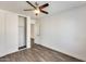 Bedroom with a closet, ceiling fan, neutral paint colors and modern flooring at 11229 E Emelita Ave, Mesa, AZ 85208