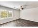 Bedroom featuring a window, ceiling fan, and neutral paint at 11229 E Emelita Ave, Mesa, AZ 85208