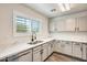 Modern kitchen featuring stainless steel appliances, stone counter tops and sleek cabinets at 11229 E Emelita Ave, Mesa, AZ 85208