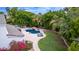 Aerial view of a private backyard with a pool, lush landscaping, and an outdoor dining area, perfect for relaxation at 1152 W Sunrise Pl, Chandler, AZ 85248