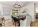 Bright dining area features a stylish light fixture and is decorated in neutral colors at 1152 W Sunrise Pl, Chandler, AZ 85248