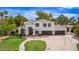 Expansive two-story home featuring a three car garage and professionally landscaped front yard at 1152 W Sunrise Pl, Chandler, AZ 85248