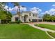 Beautiful two-story home boasts manicured landscaping and a spacious three-car garage at 1152 W Sunrise Pl, Chandler, AZ 85248