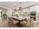 Kitchen with stainless steel appliances, white cabinets, and a large kitchen island at 1152 W Sunrise Pl, Chandler, AZ 85248