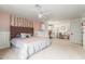 Spacious main bedroom featuring an ensuite office space, plush carpet, and a decorative pink and white color scheme at 1152 W Sunrise Pl, Chandler, AZ 85248