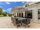 Stylish outdoor patio featuring a dining area with an umbrella, perfect for enjoying meals outside at 1152 W Sunrise Pl, Chandler, AZ 85248