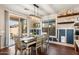 Dining room featuring a modern light fixture and sliding glass door at 12132 W Daley Ln, Sun City, AZ 85373